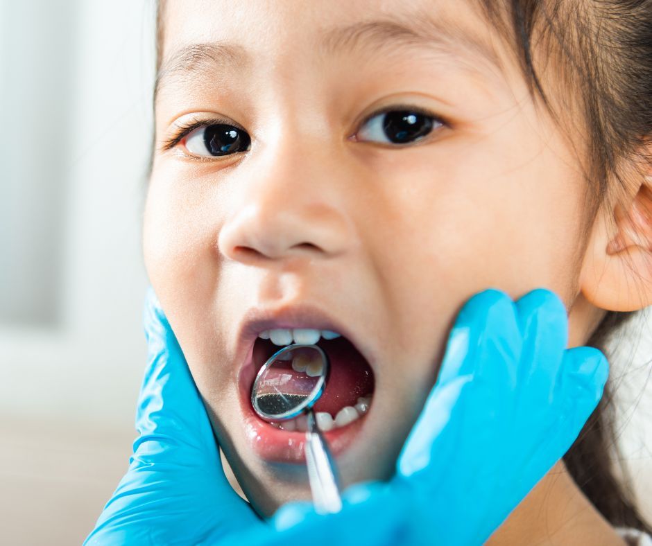Child receiving a dental check-up.