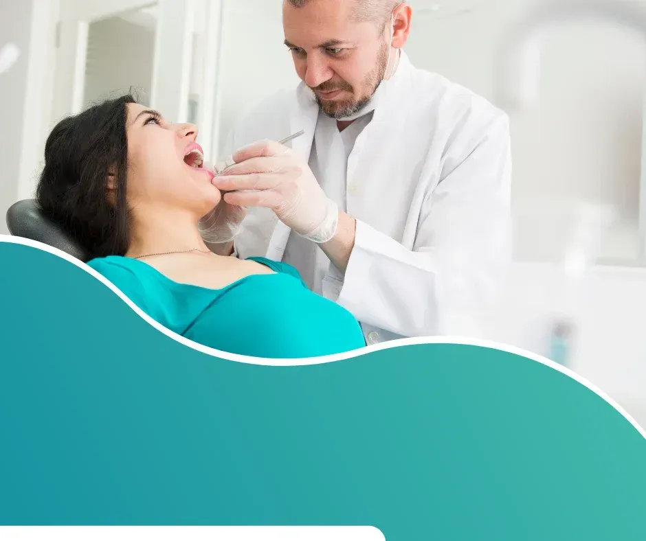 Dentist examining patient’s teeth during check-up