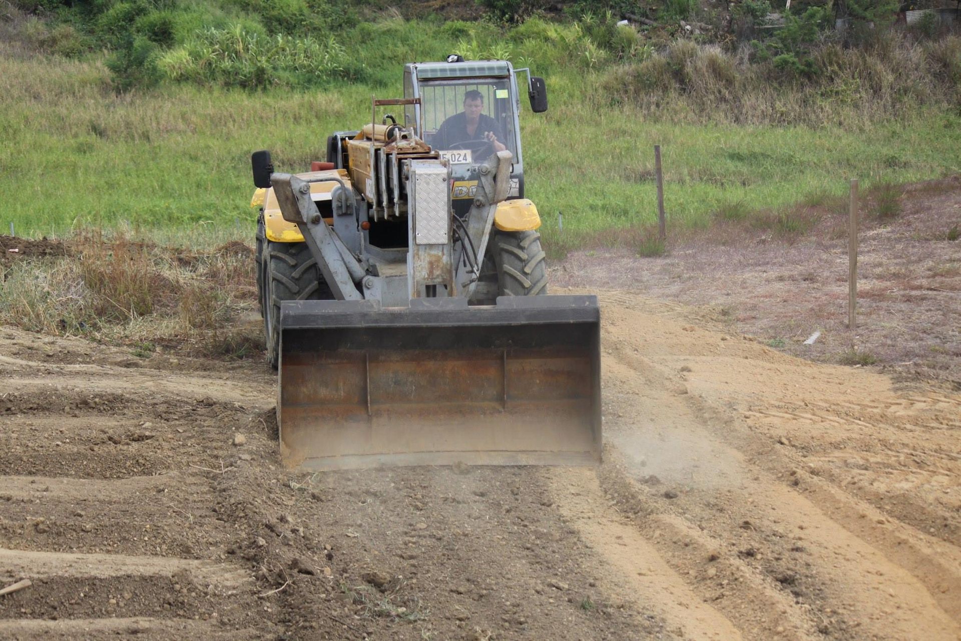 a digger at work in a field