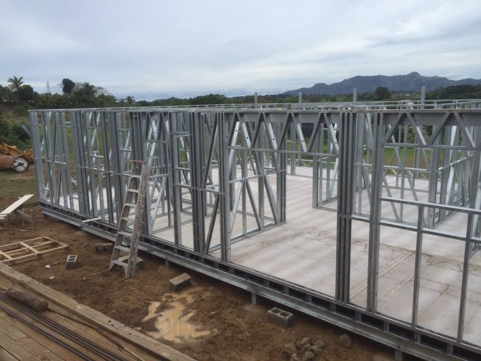 house frames in aluminium on a wooden platform