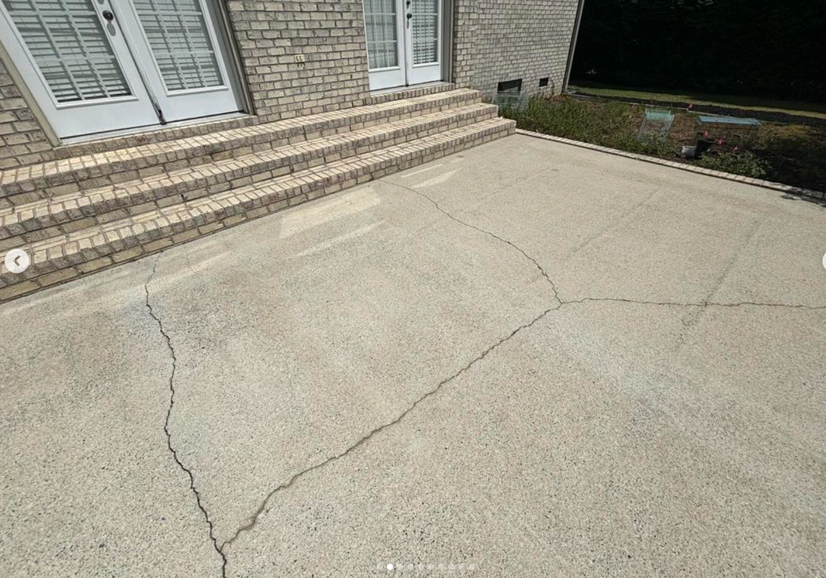 A wooden deck is being cleaned by a pro wash company.