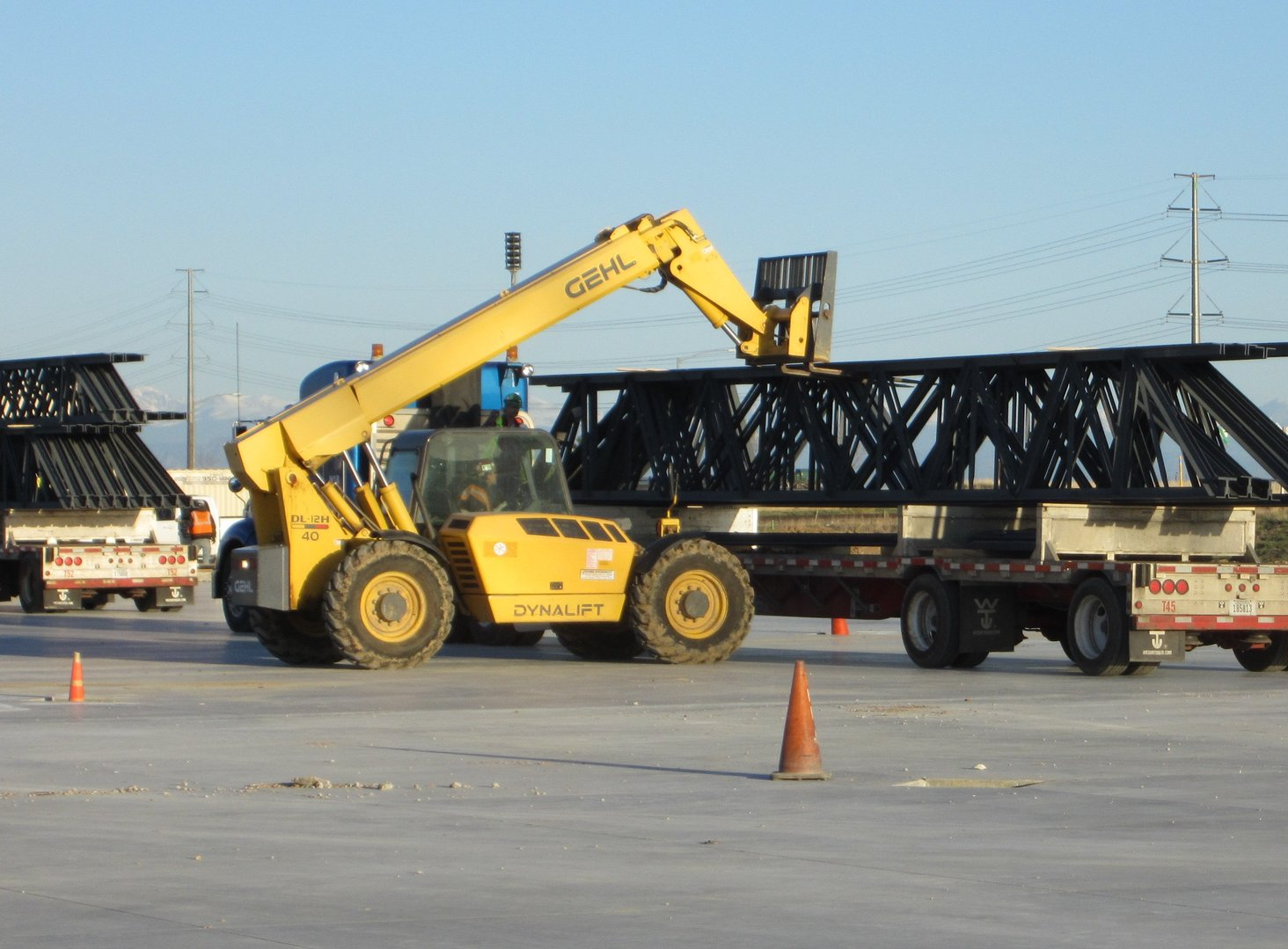 A yellow forklift with the word genie on it