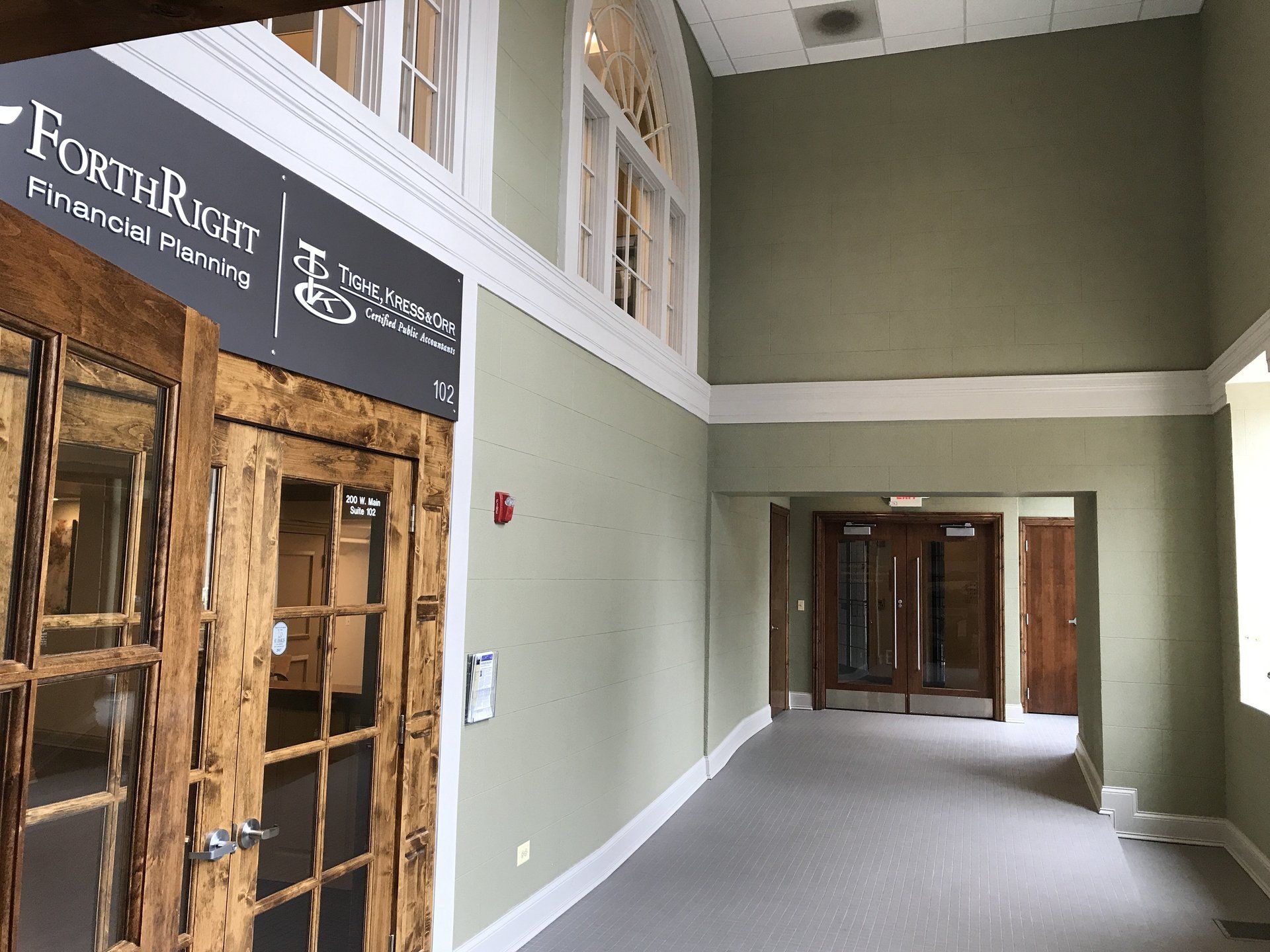 A hallway with a sign that says forthright on it