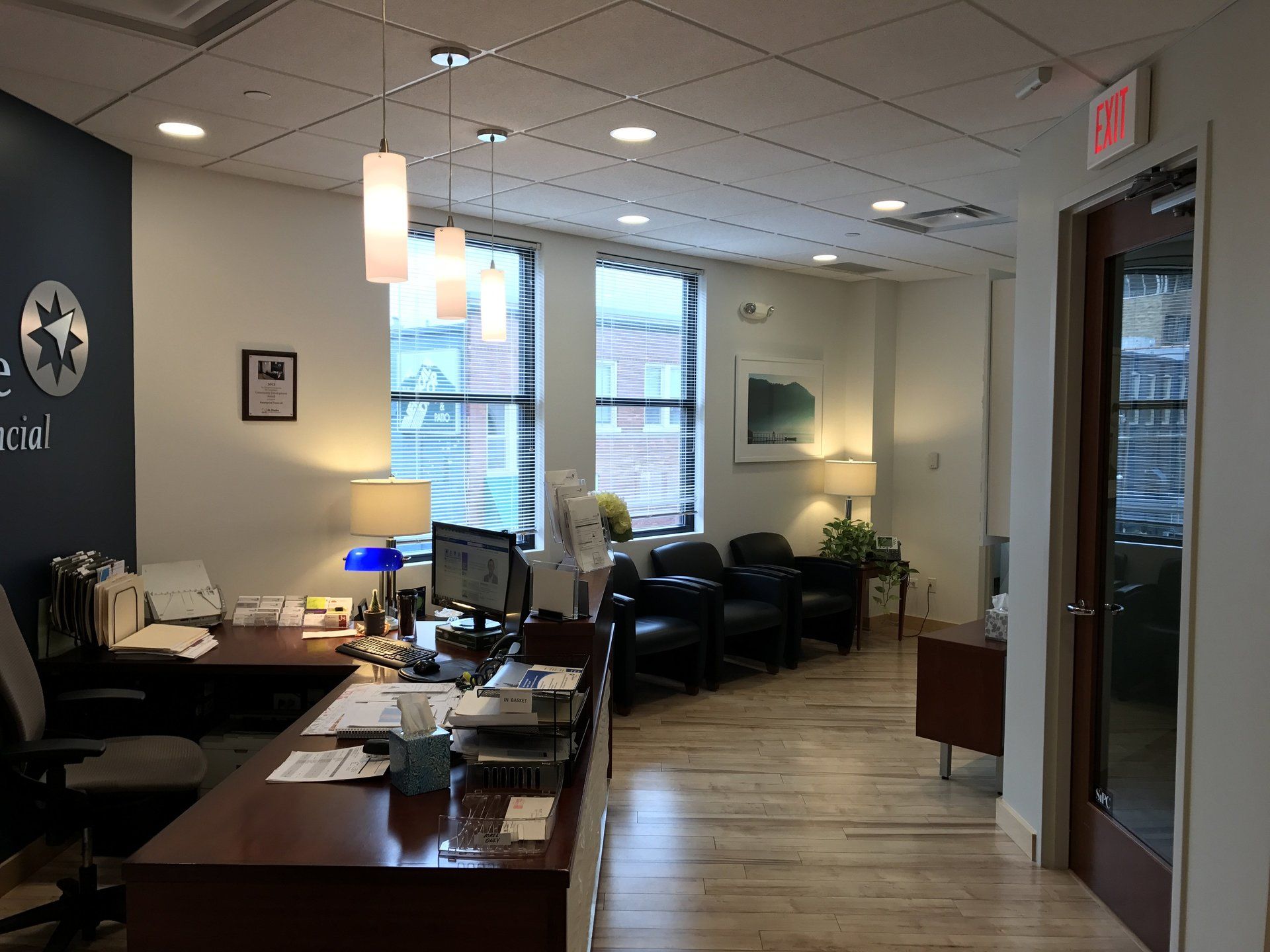 A waiting room with a sign that says ' exit ' on it