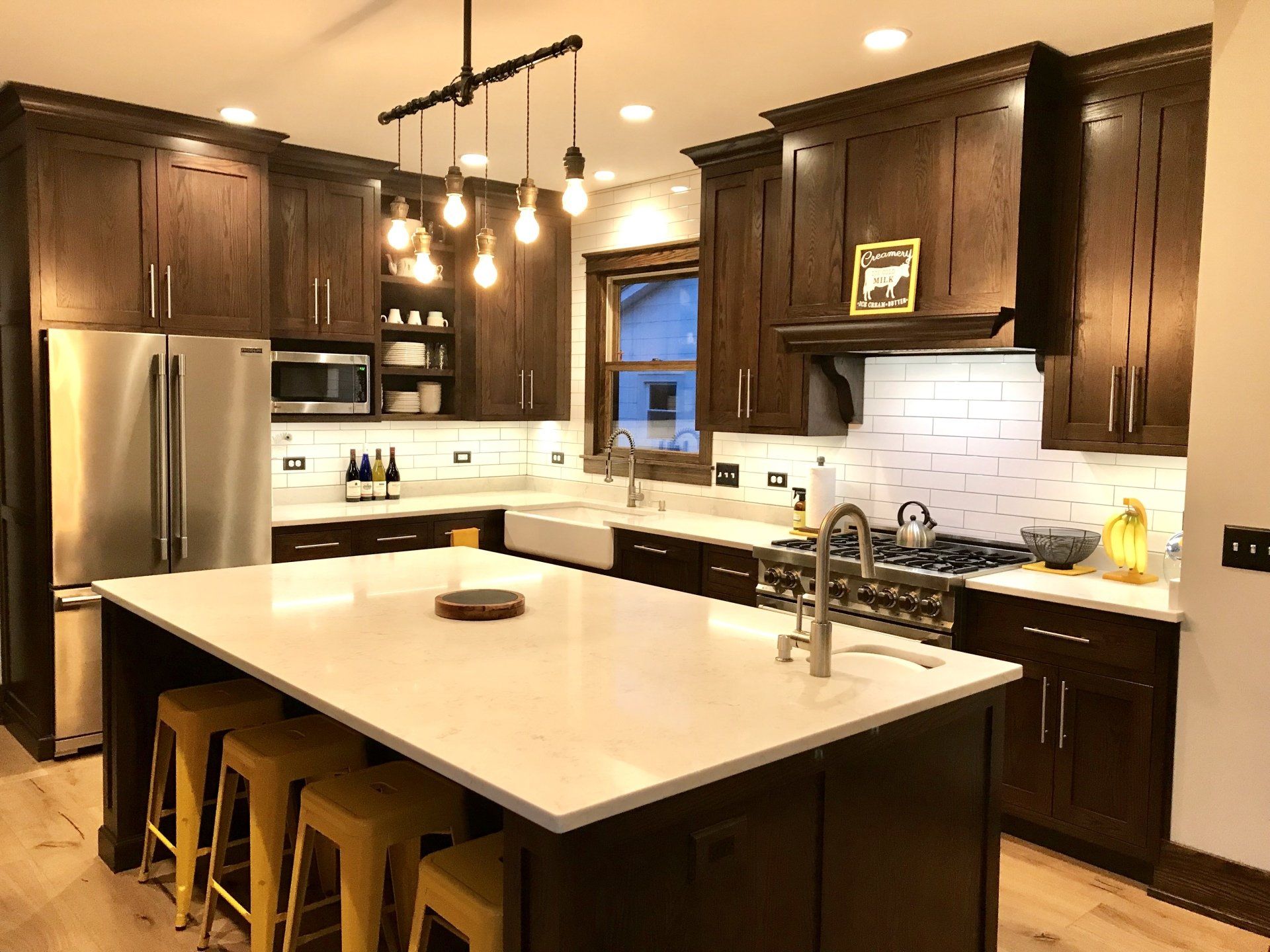 A kitchen with a large island in the middle of it.