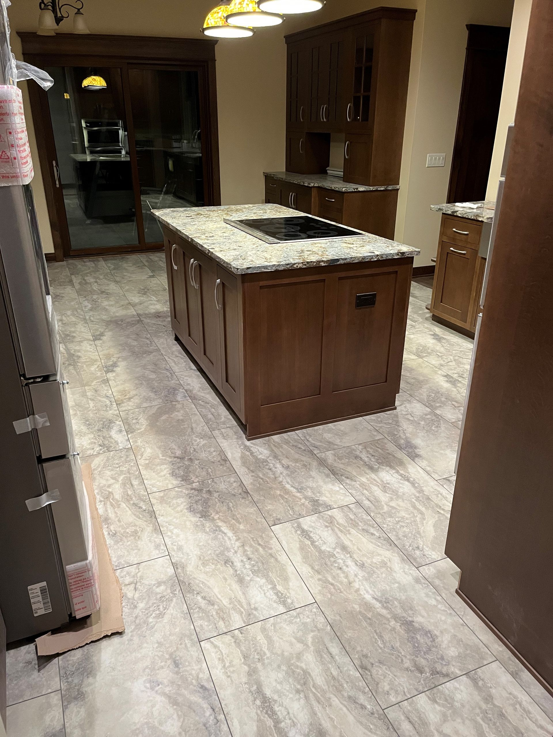 A kitchen with a large island in the middle of the room.