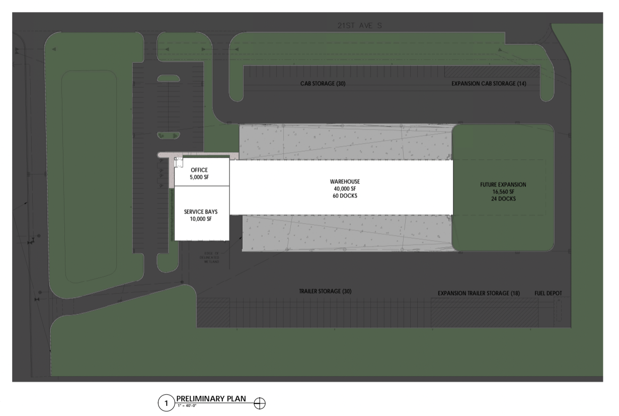 An aerial view of a building with a lot of parking spaces