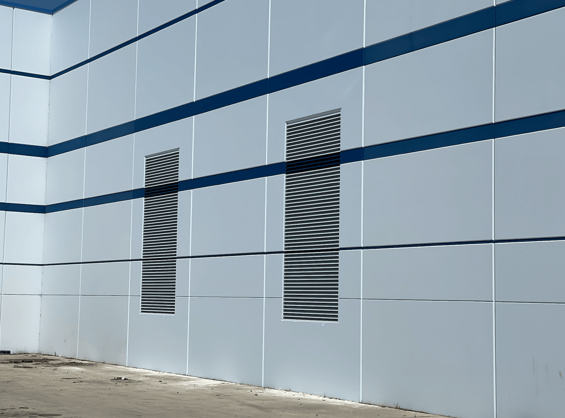 A white wall with blue stripes on it