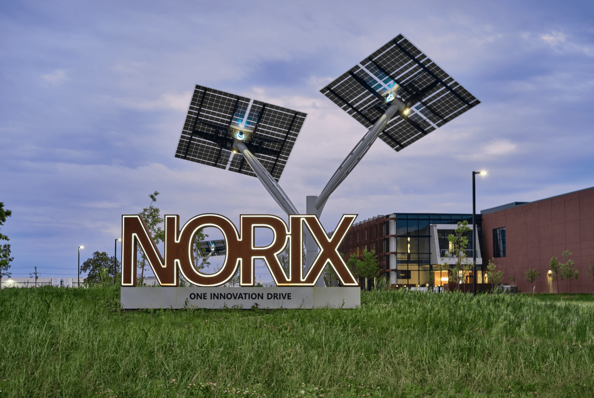A sign for norix is surrounded by solar panels
