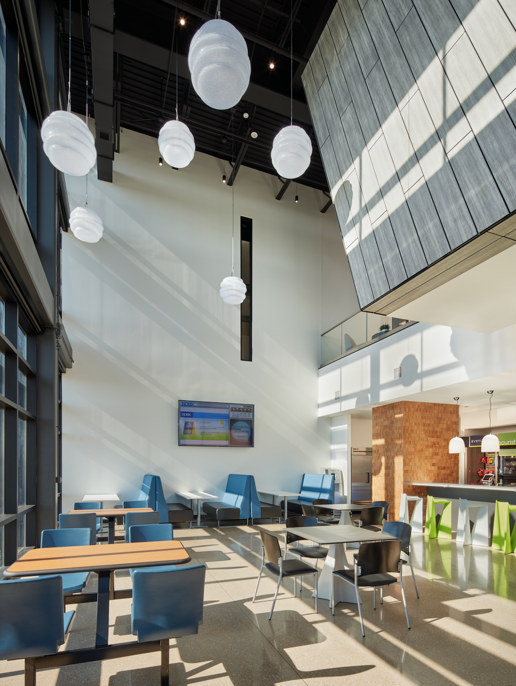 A large room with tables and chairs in it