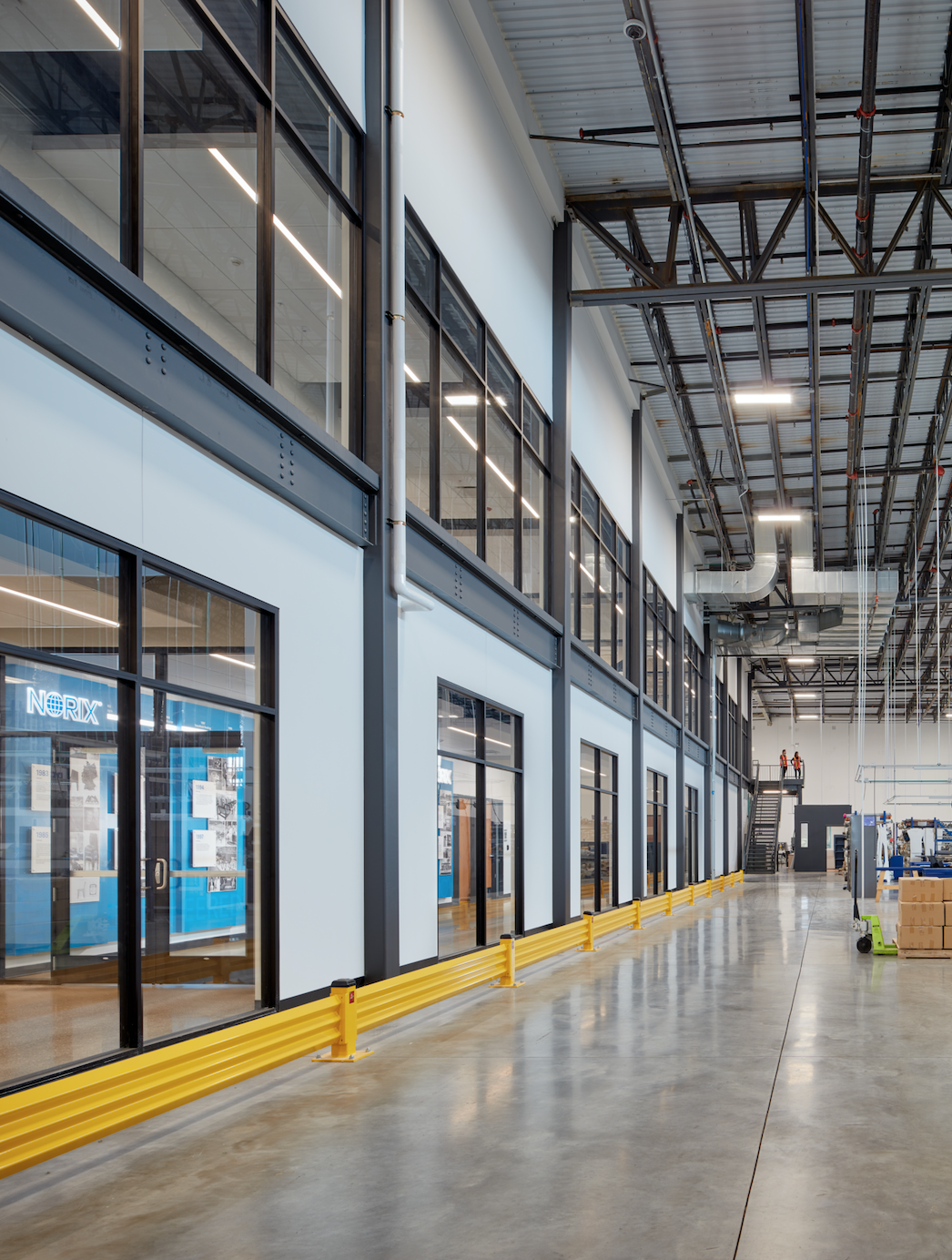 A large building with a lot of windows and a sign that says biotech
