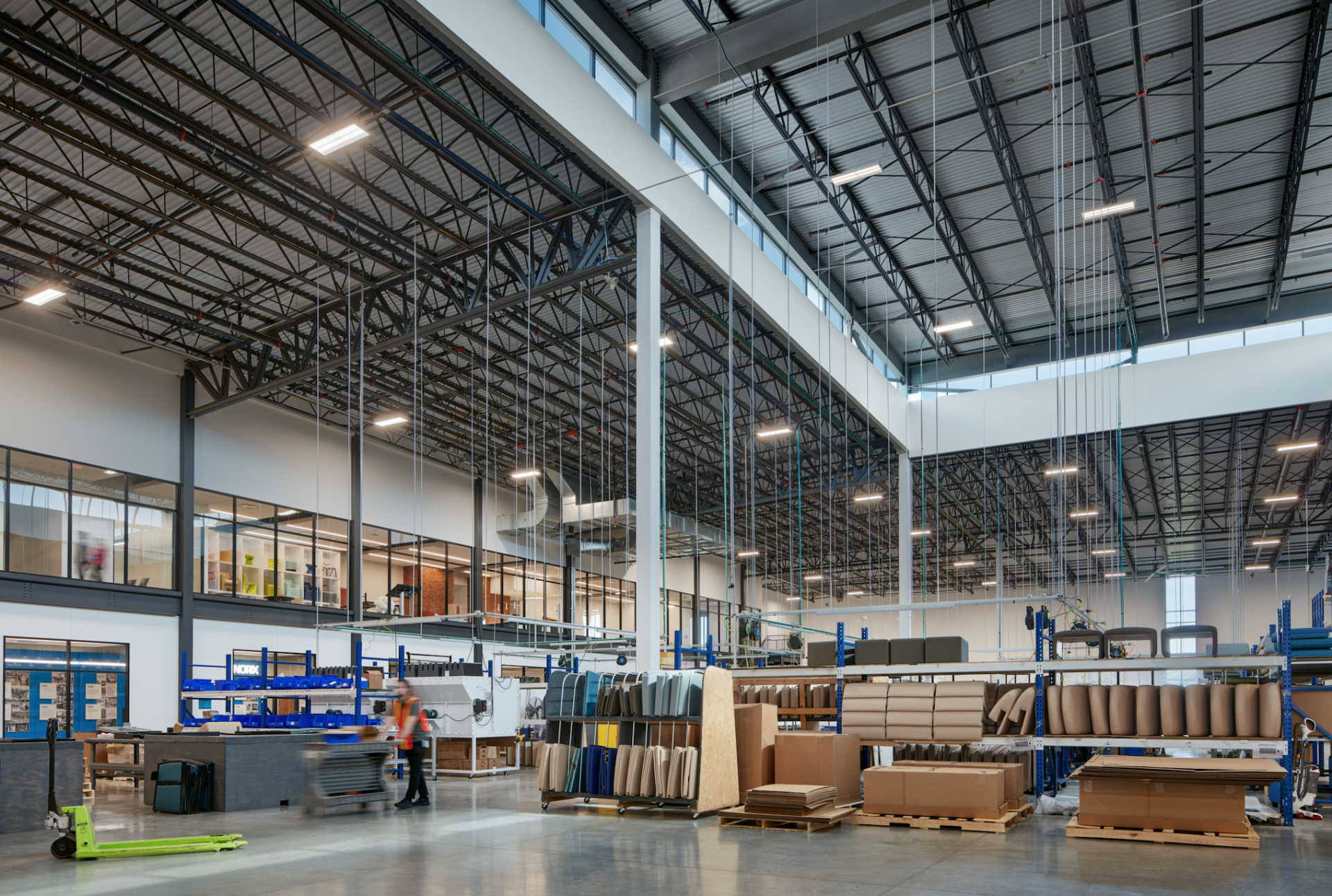 A large warehouse filled with lots of boxes and pallets.