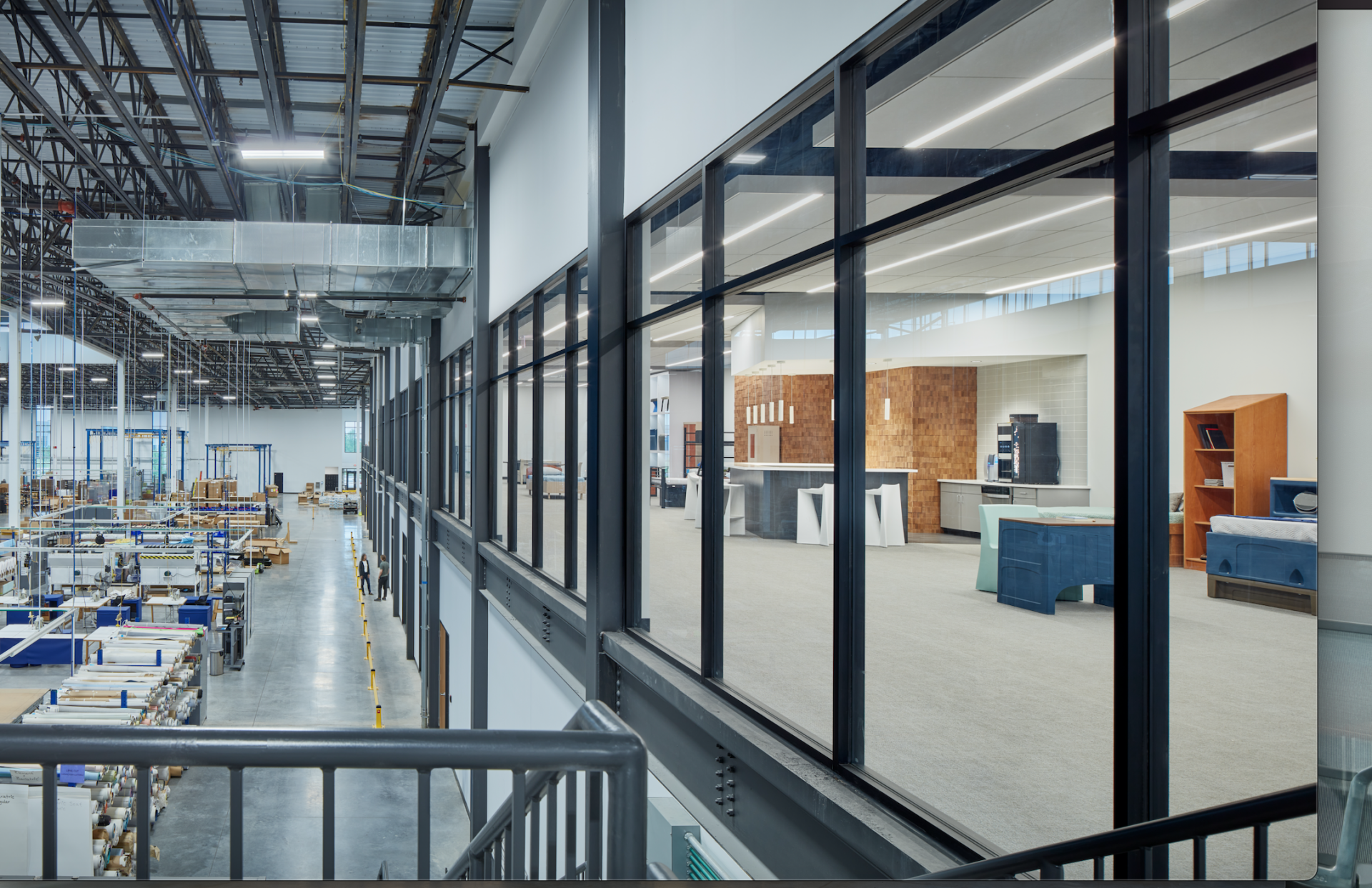 A large warehouse with lots of windows and stairs