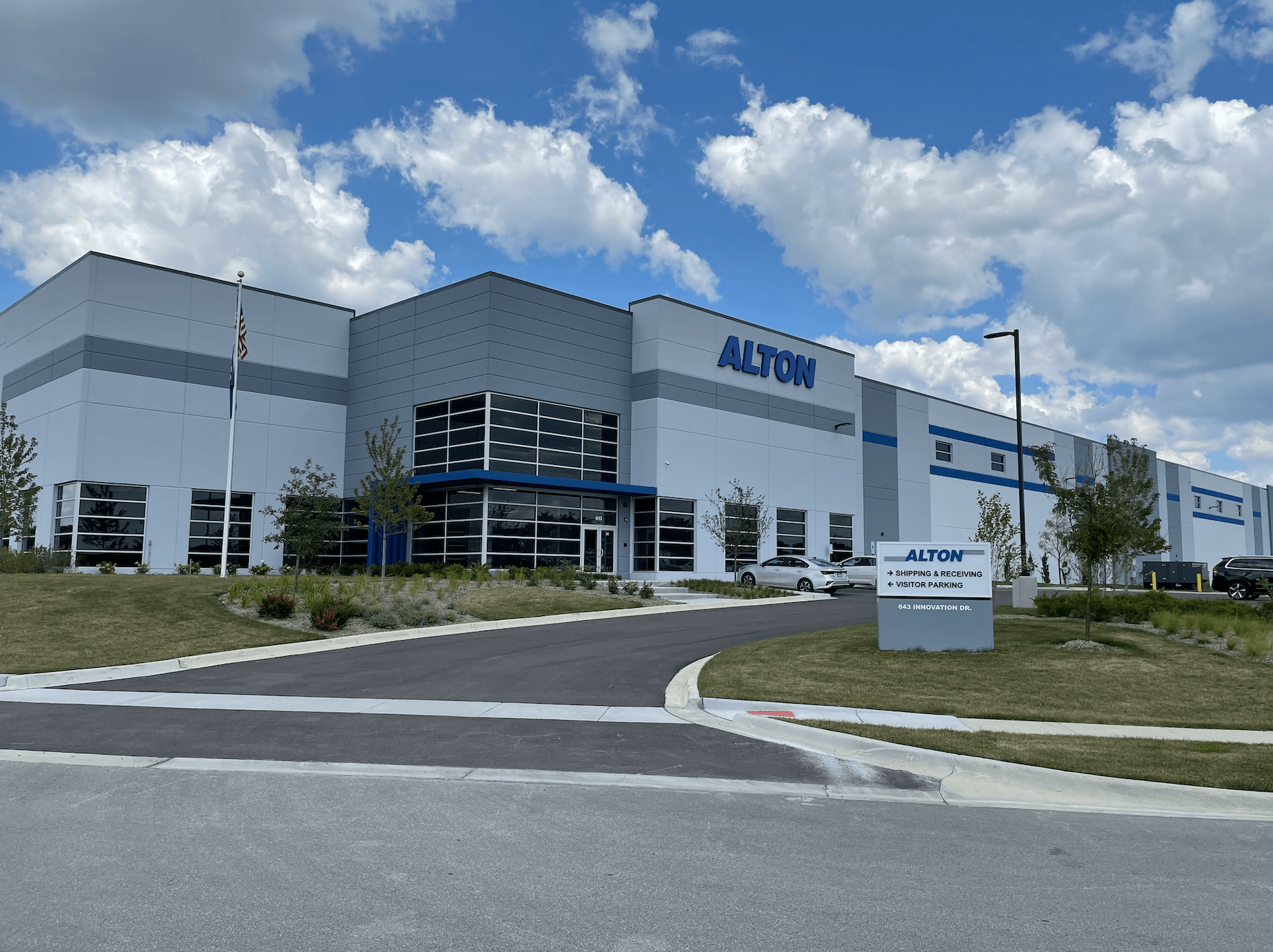 A large white building with the word alton on it