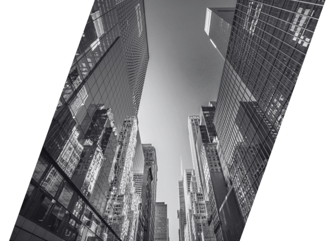 A black and white photo of a city with tall buildings