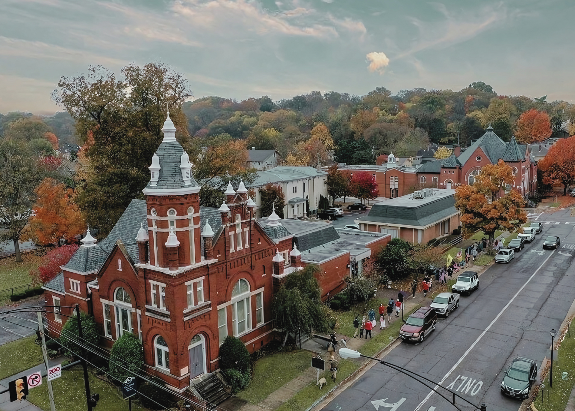 An aerial view of a church in a small town