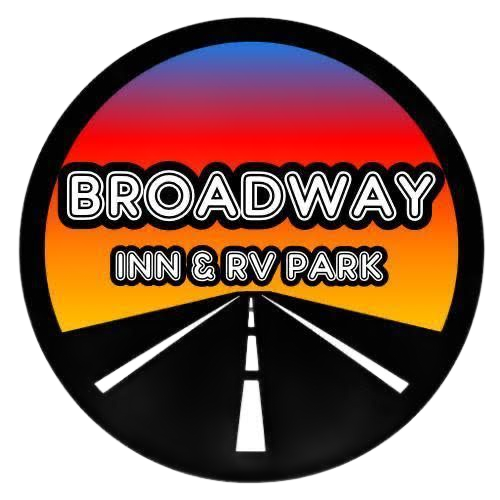 Broadway Inn & RV Park logo: circular, road at sunset, with text