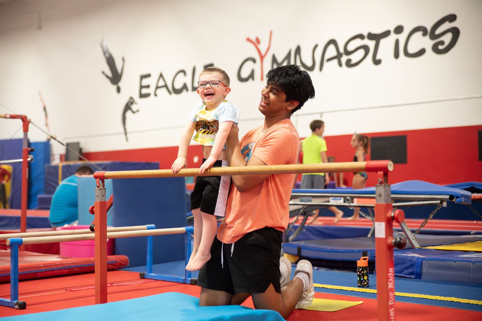 A girl and a boy are giving each other a high five