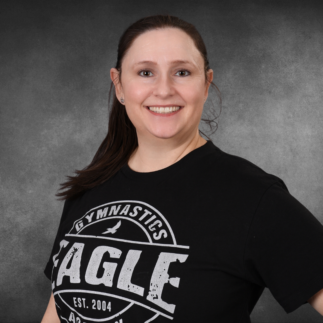 A woman wearing a black shirt that says eagle on it
