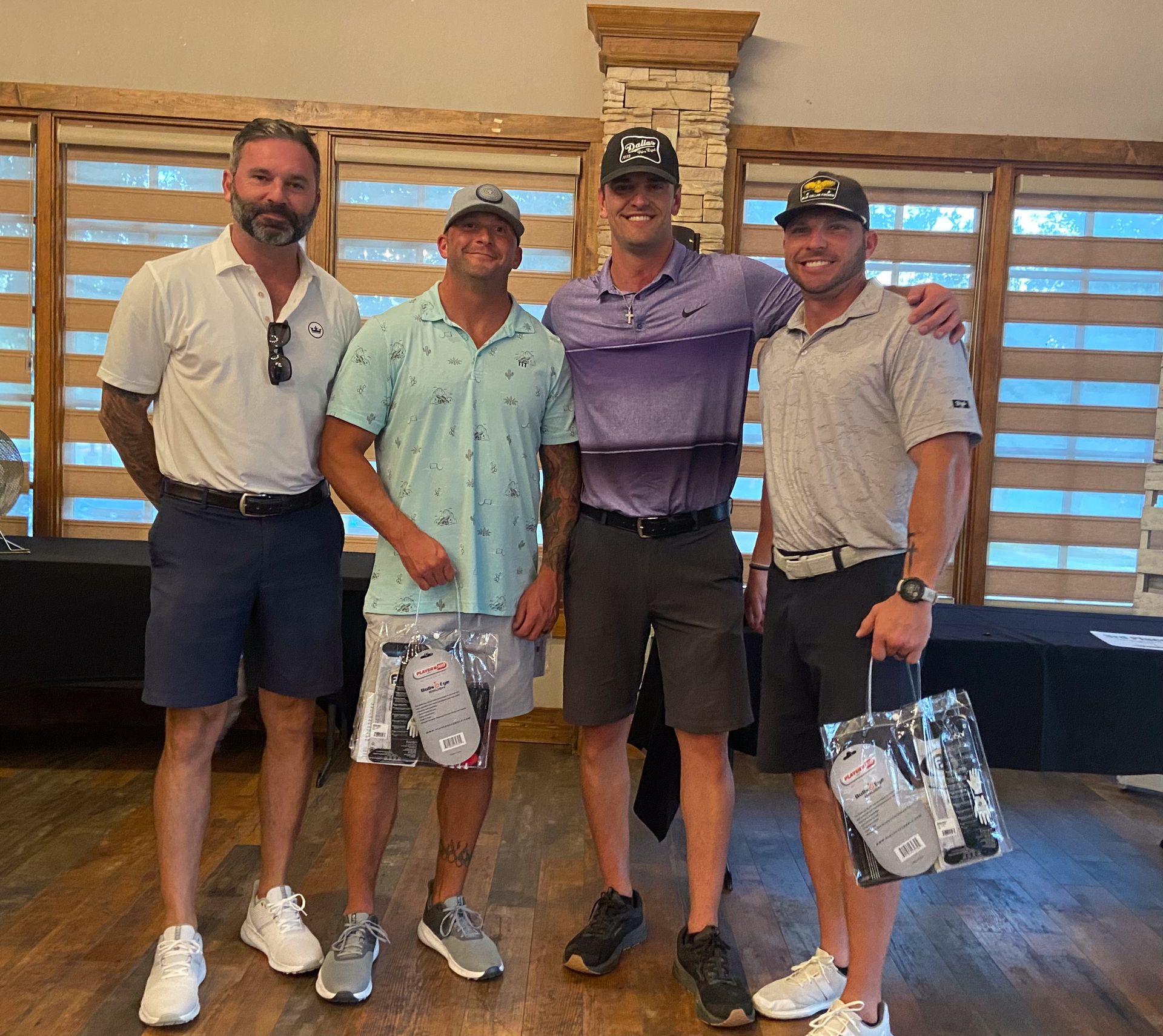 A group of men are posing for a picture in a room.