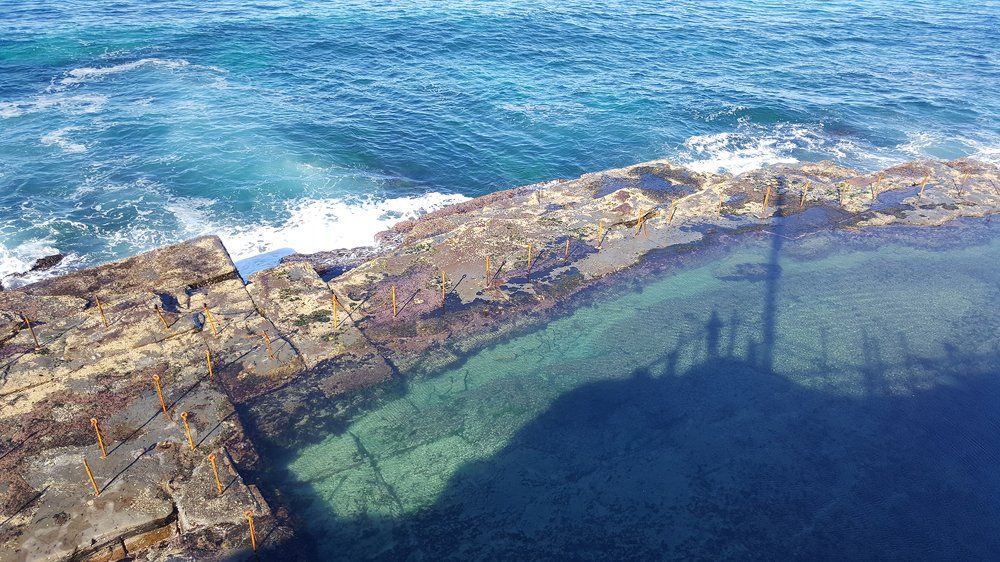 Blue Sea And Rocky Shore — Accountants in Morisset, NSW