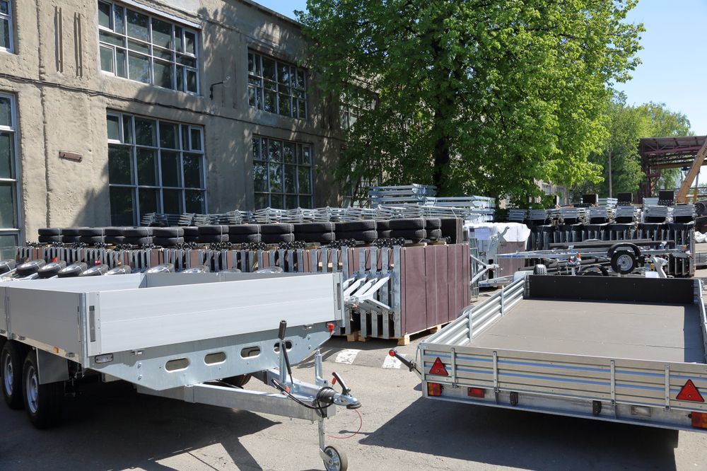 Several New Trailers Parked Outdoors in Front of a Building — Drop Deck Trailers In Urangan QLD