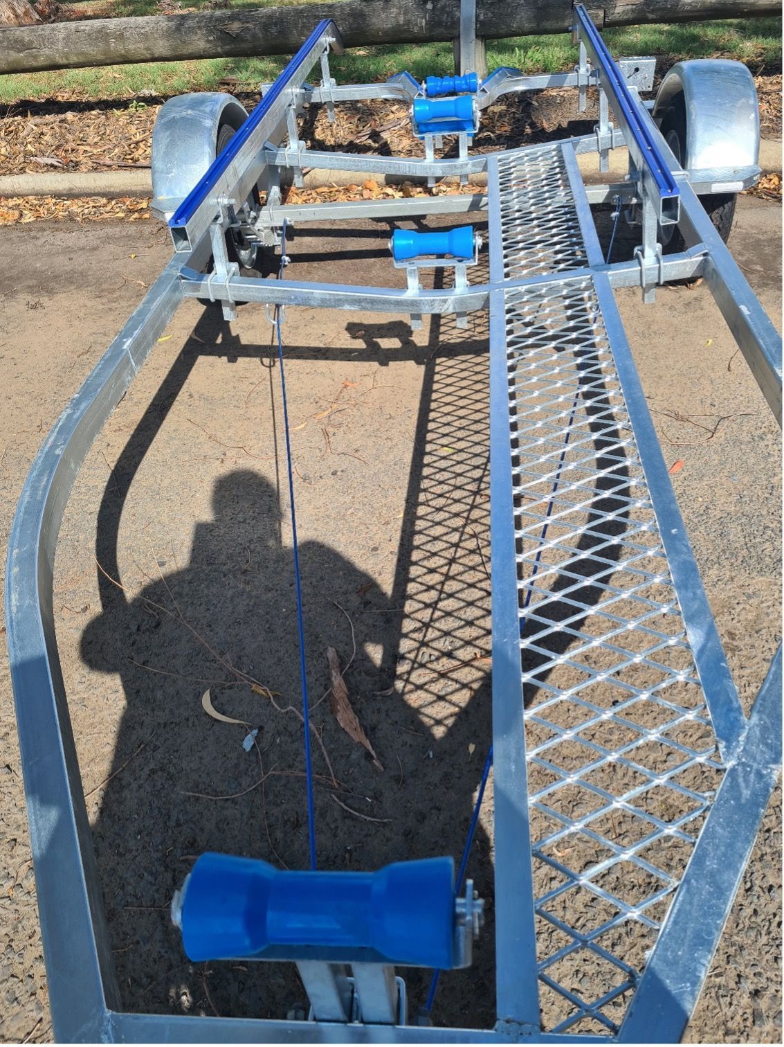 A Boat Trailer is Parked on the Side of The Road — Drop Deck Trailers In Urangan QLD