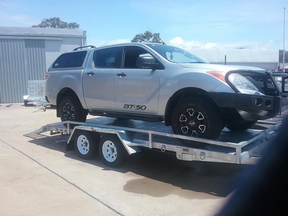 BT-50 Pick Up Vehicle Loading On The Car Carrier Trailer — Drop Deck Trailers In Urangan QLD
