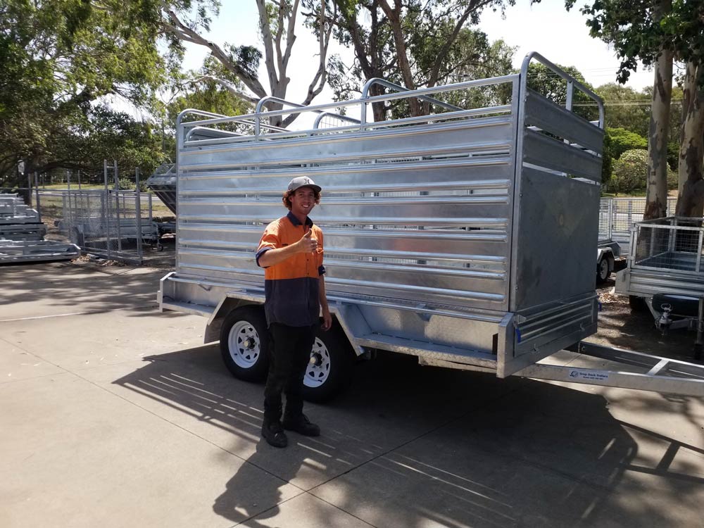 Man Giving Thumbs Up Beside a Cattle Trailer — Drop Deck Trailers In Gympie QLD