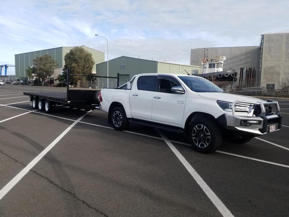 White Vehicle With Flatbed Trailer — Drop Deck Trailers In Urangan QLD