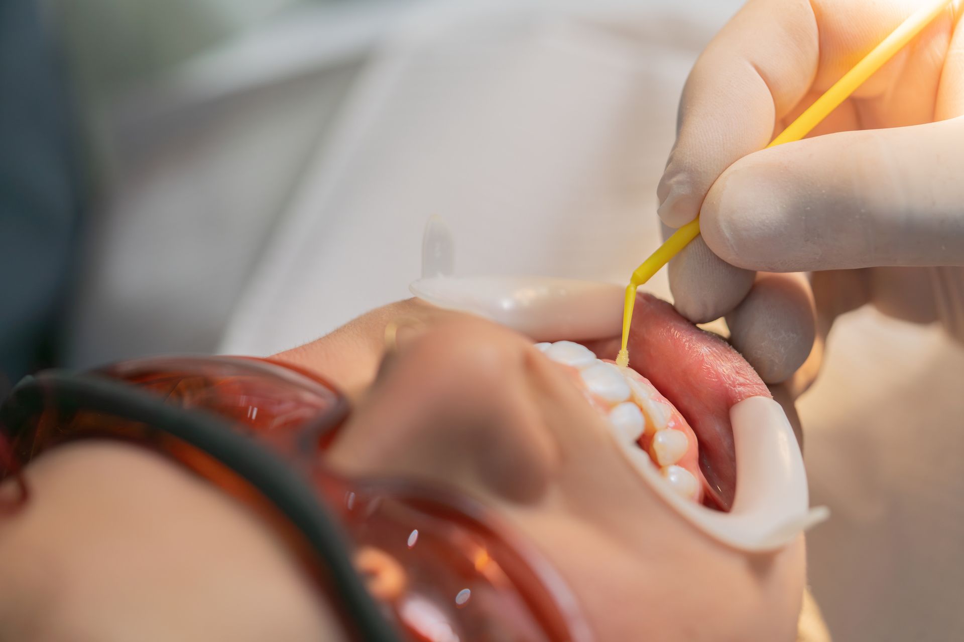 Cosmetic dentists are delivering precise, comfortable dental care during a patient procedure.