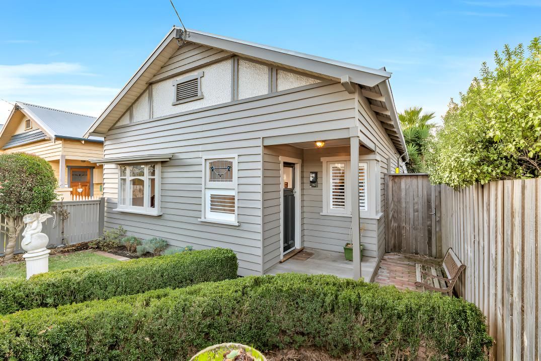 A Small House With A Porch And A Fence — Angel Conveyancing In Larrakeyah, NT