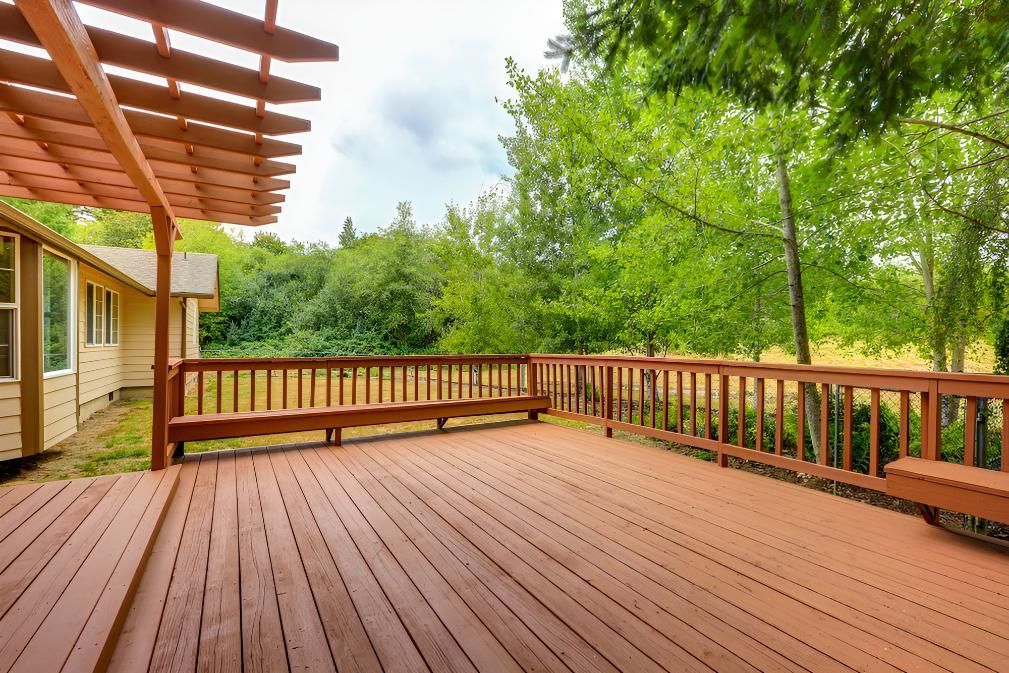 An Empty Wooden Deck With A Pergola — Angel Conveyancing In Larrakeyah, NT
