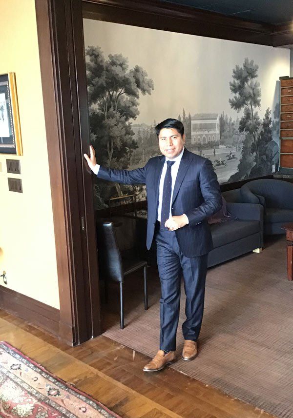 young man standing in door frame