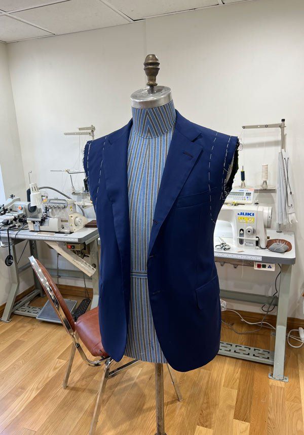 suit jacket with alteration marks on mannequin