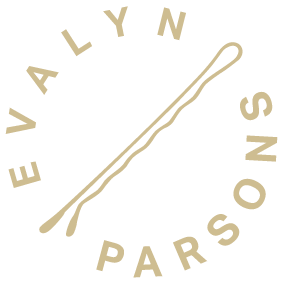 Evalyn Parsons Gold Logo.  Words in a circle with a bobby pin in the middle.