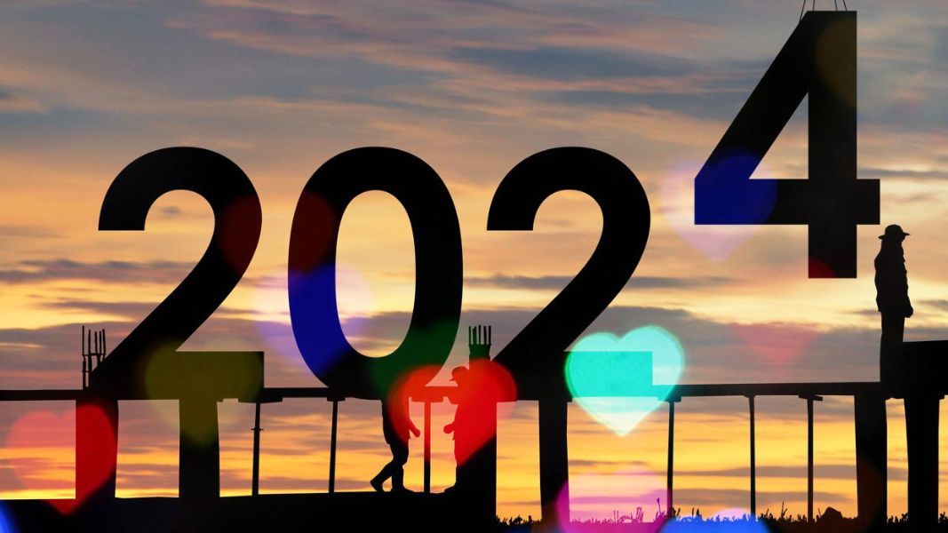 the year 2024 is displayed with a sunset in the background