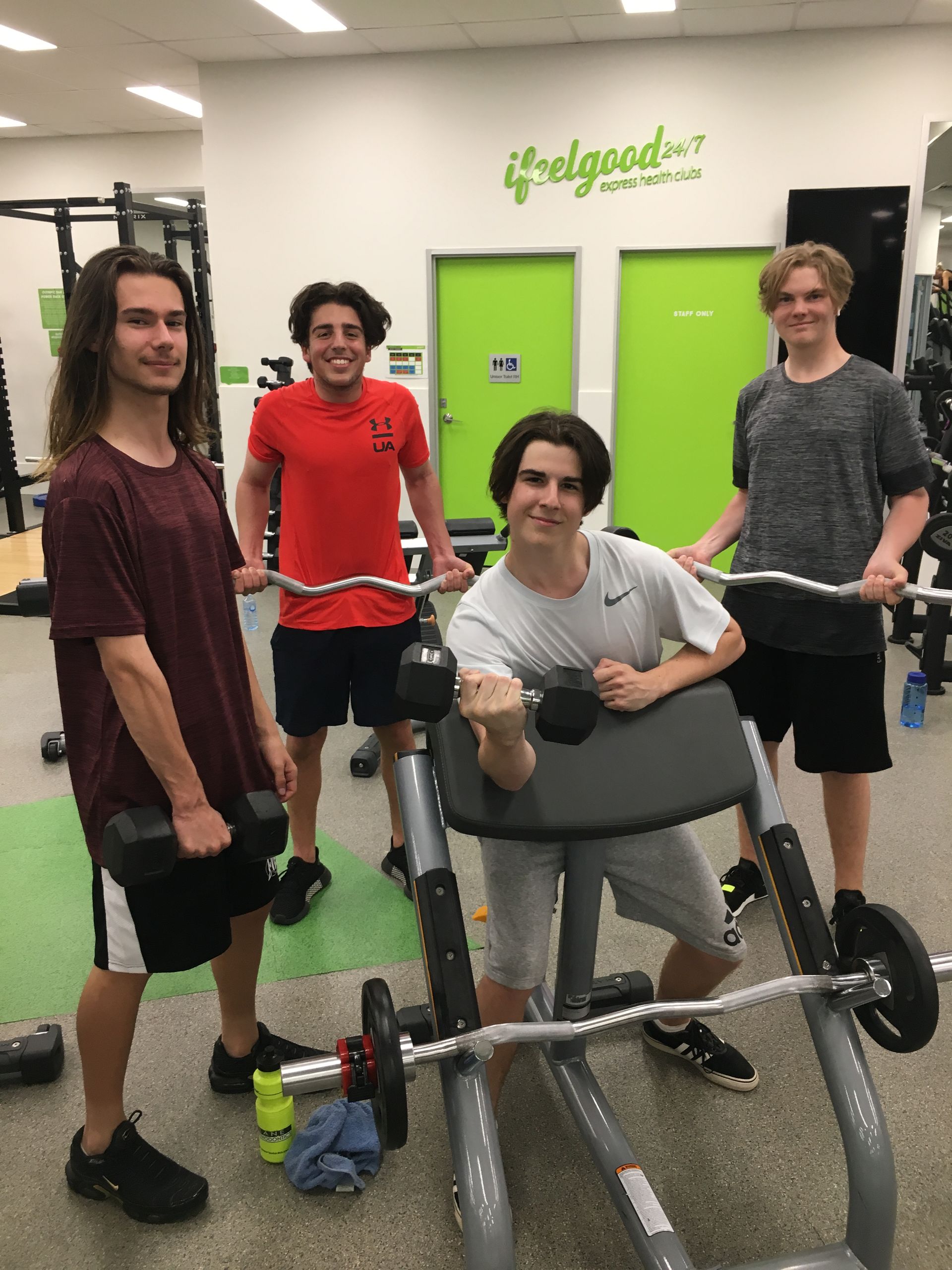 Four Men Holding Equipment in the Gym — ifeelgood 24/7 Oxenford In Oxenford, QLD