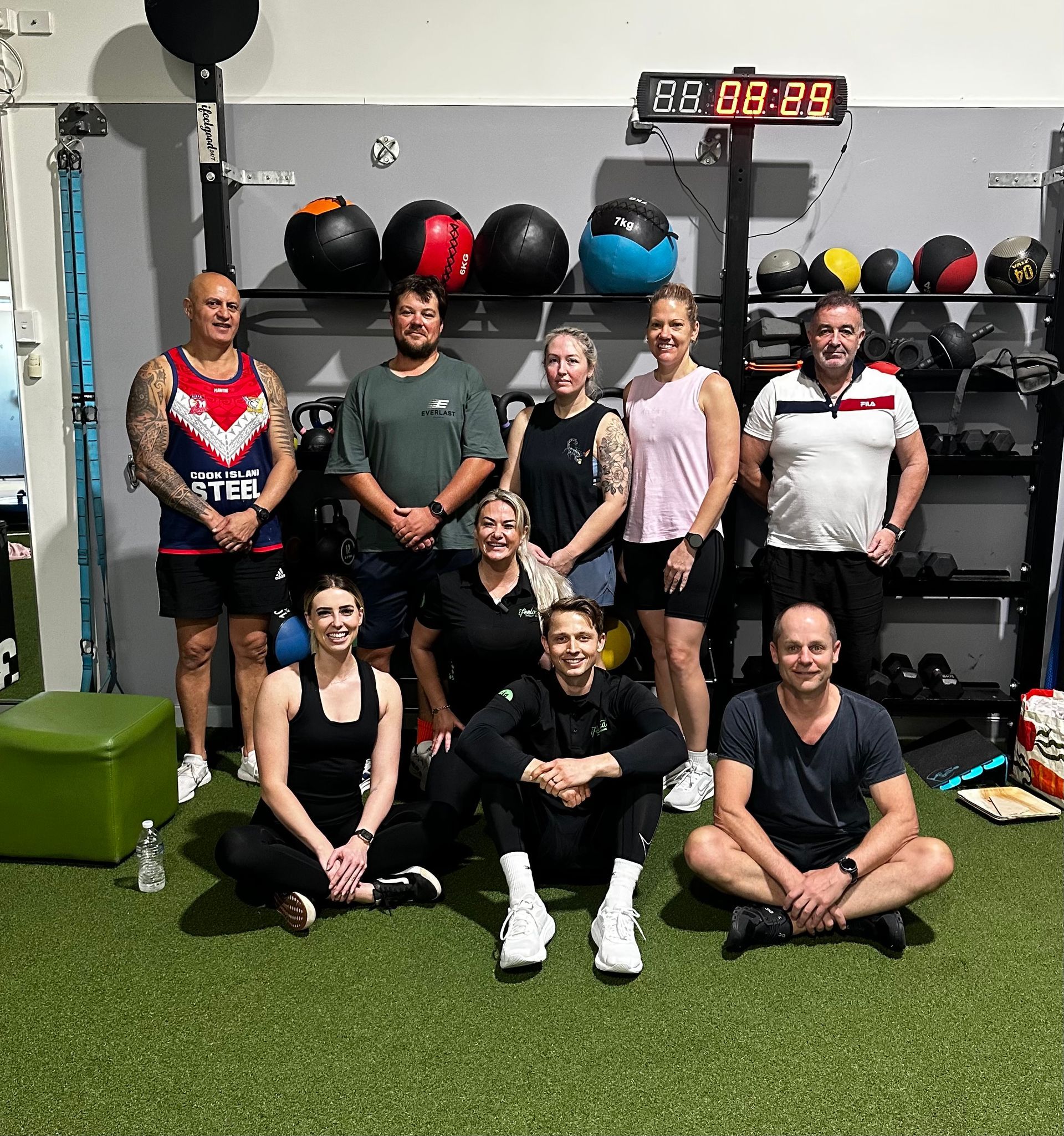 A group of People Smiling and Posing for Image After Completing Workout— ifeelgood 24/7 Oxenford In Oxenford, QLD