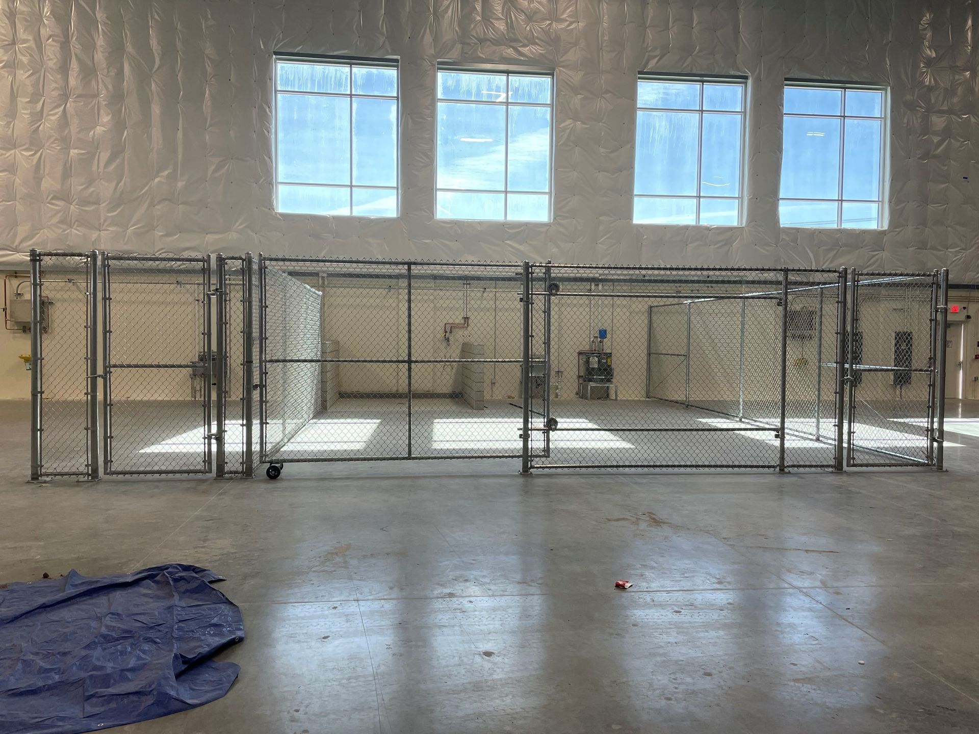 A Large Empty Room with A Fence and Windows — Nuevo, CA — Golden West Fence