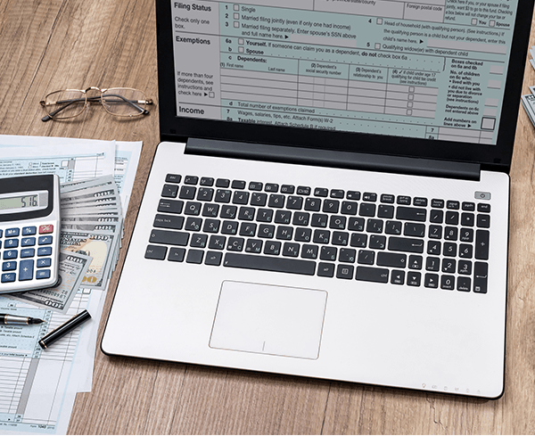 Payroll & Tax Filing Company — Tax Form On Desktop in Laredo, TX