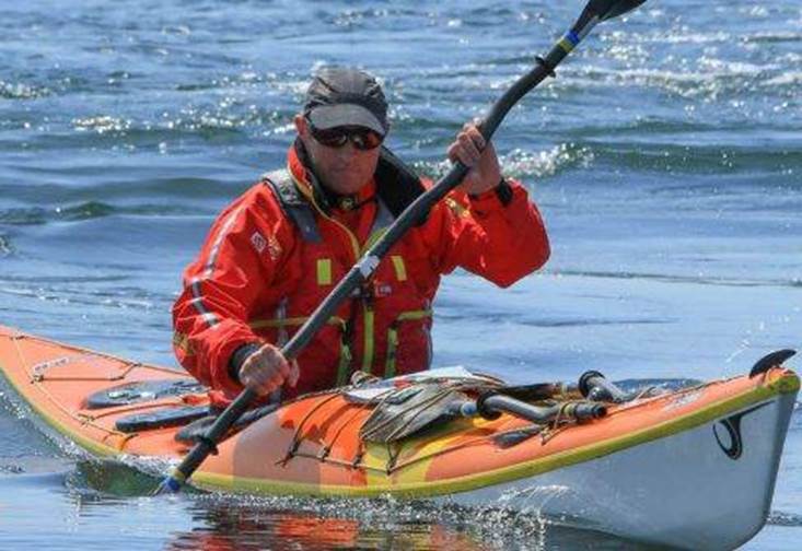 Photo of Adam Harmer in a sea kayak