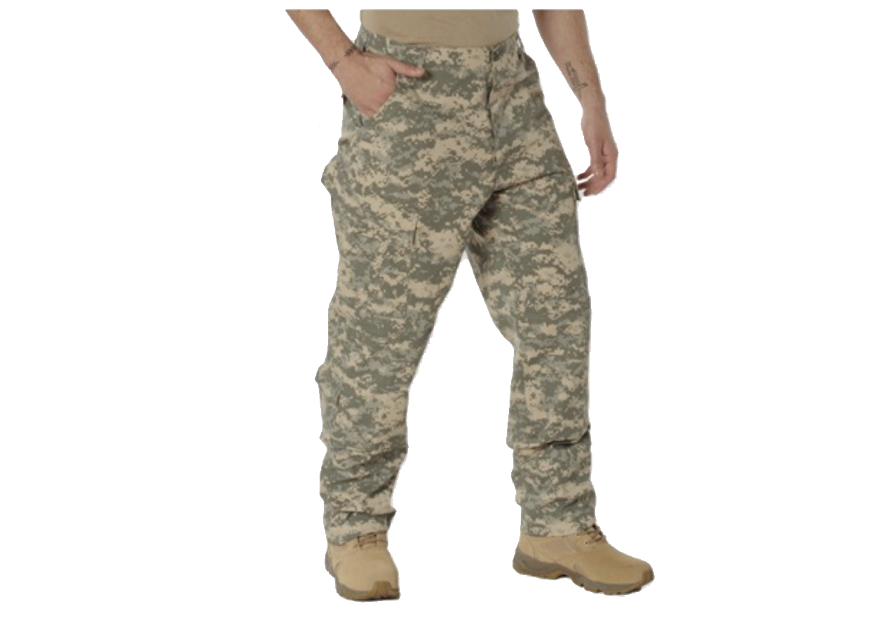 Military items displayed in front of a building with an American flag, camouflage, and ammo cans.