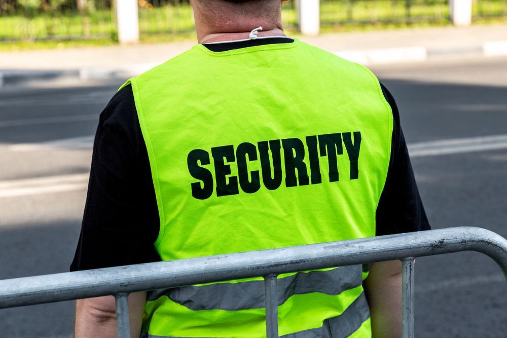 Security Man Wearing A Yellow Vest — Professional Security Guards in Emerald, QLD