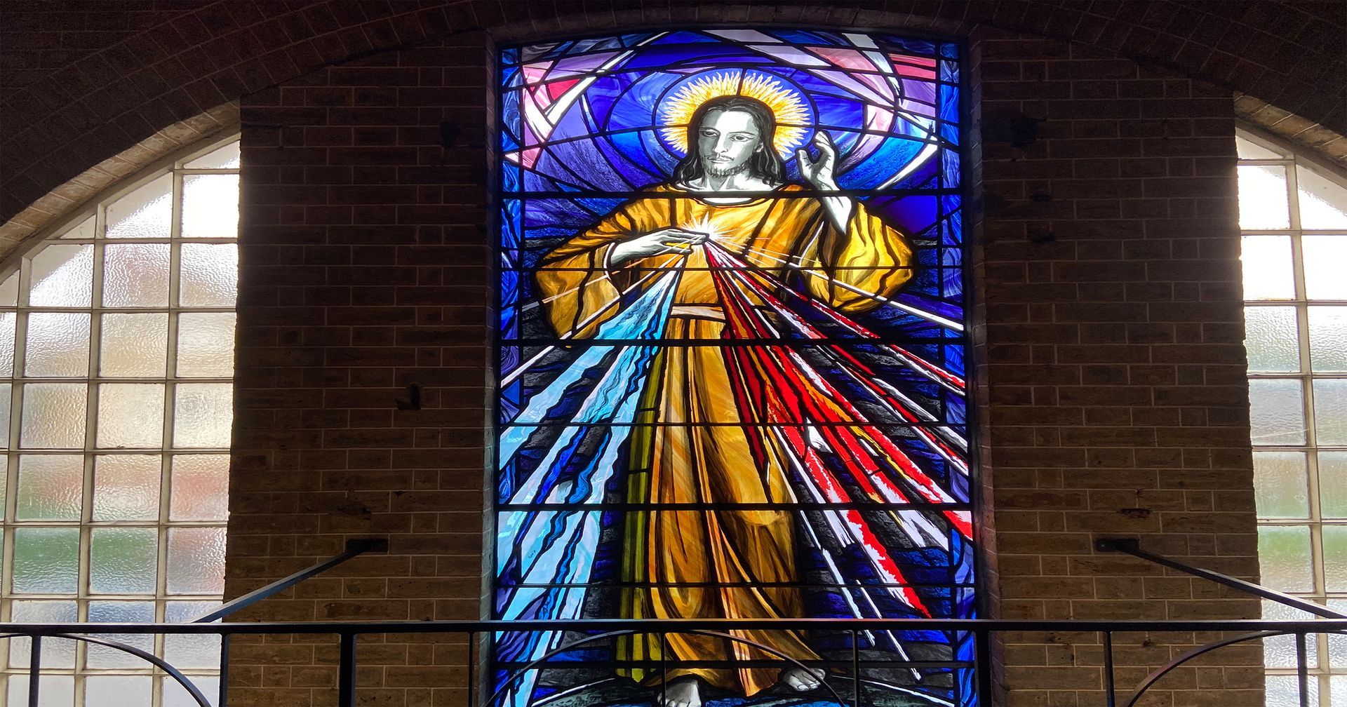 A stained glass window of jesus in a church