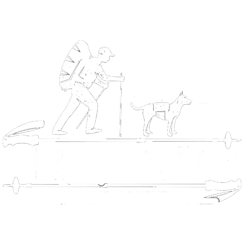 Hiker with backpack and walking stick, accompanied by a dog wearing a pack, hiking outdoors.