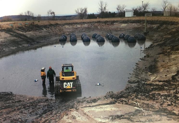 Heavy Equipment Working In The Pond — Arbor Vitae, WI — Howard Bros.