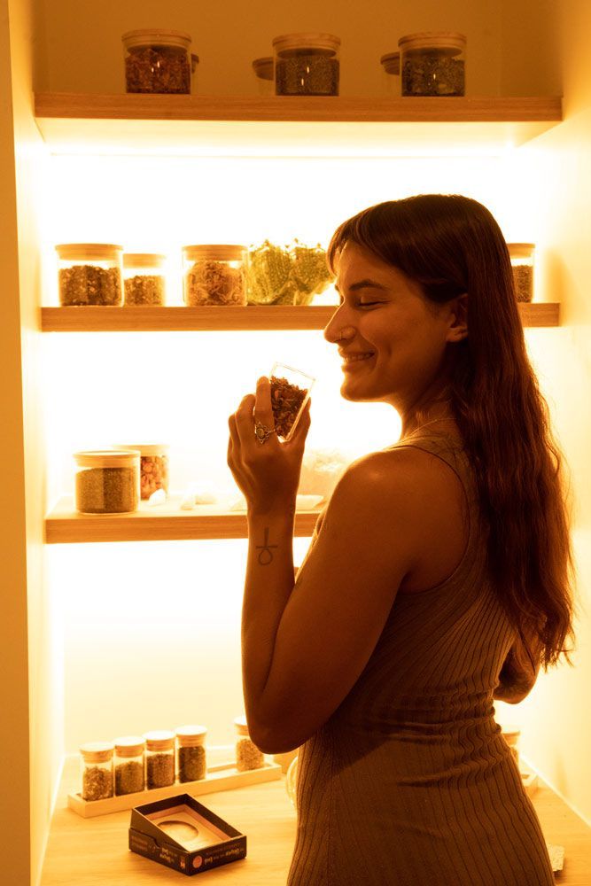 Happy Woman Smelling Herbs — Yoni Steam Australia