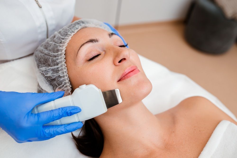 Woman is Getting a Facial Treatment at a Beauty Salon — Gladstone Beauty Clinic In Gladstone Central, QLD