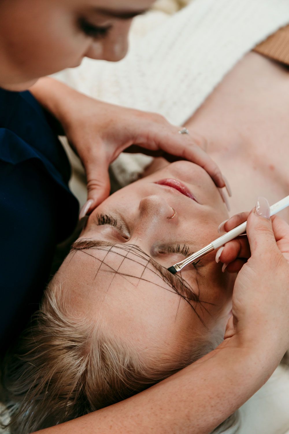 Woman Making Eyebrows Shaping — Gladstone Beauty Clinic In Gladstone Central QLD